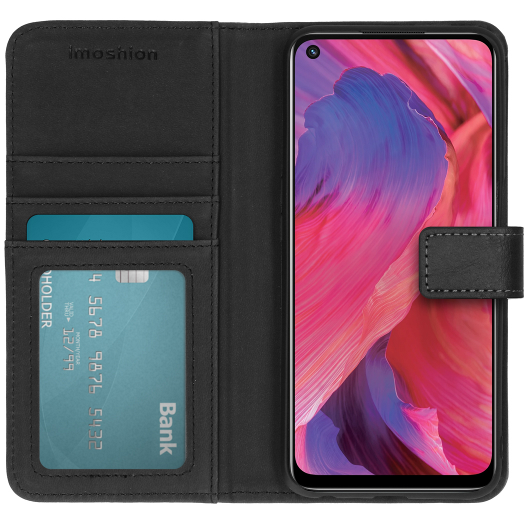 Zwarte telefoonhoes geopend, toont een telefoon met kleurrijke achtergrond en creditcard.