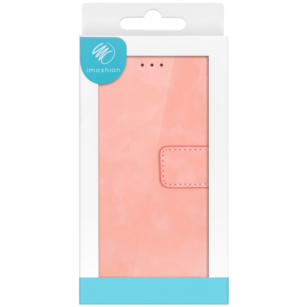 Un étui de téléphone rose dans une boîte blanche. L'étui a une fermeture magnétique et une fente pour carte.
