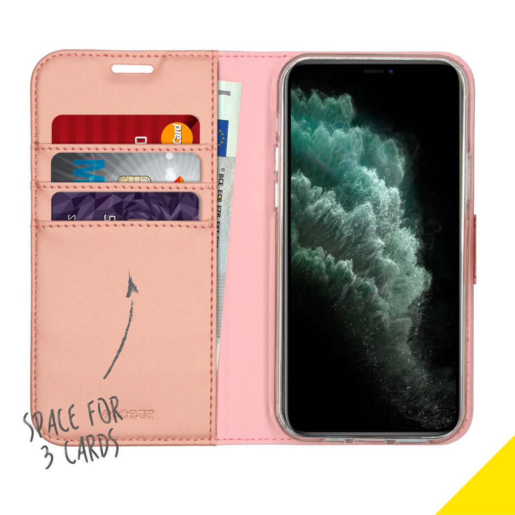 A pink phone case opened showing cards and a phone with a black screen.