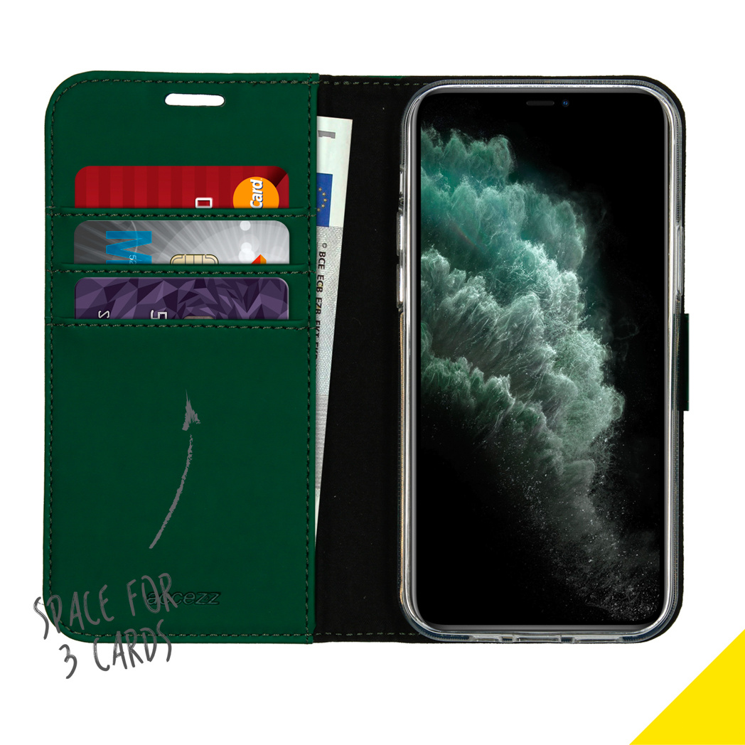 Open green phone case with cards and money inside. A phone is displayed. Background is yellow.