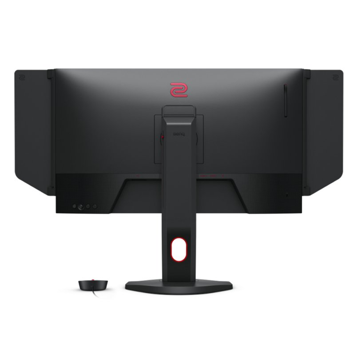 The back of a large black computer monitor with a stand and connected cables.