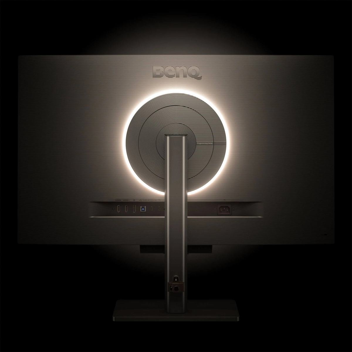 Tył monitora z podświetlanym pierścieniem i podstawą.