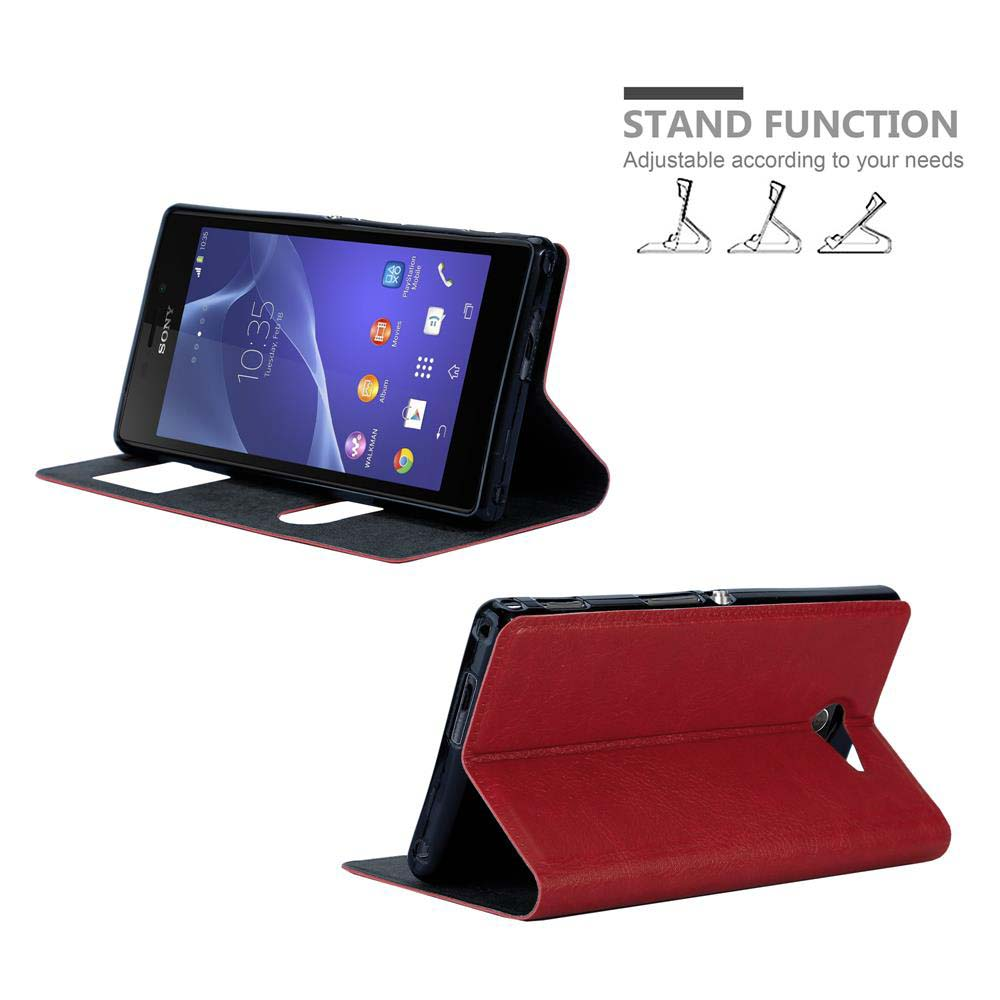Teléfono en una funda roja. La funda puede estar de pie, y la pantalla muestra la hora y aplicaciones.