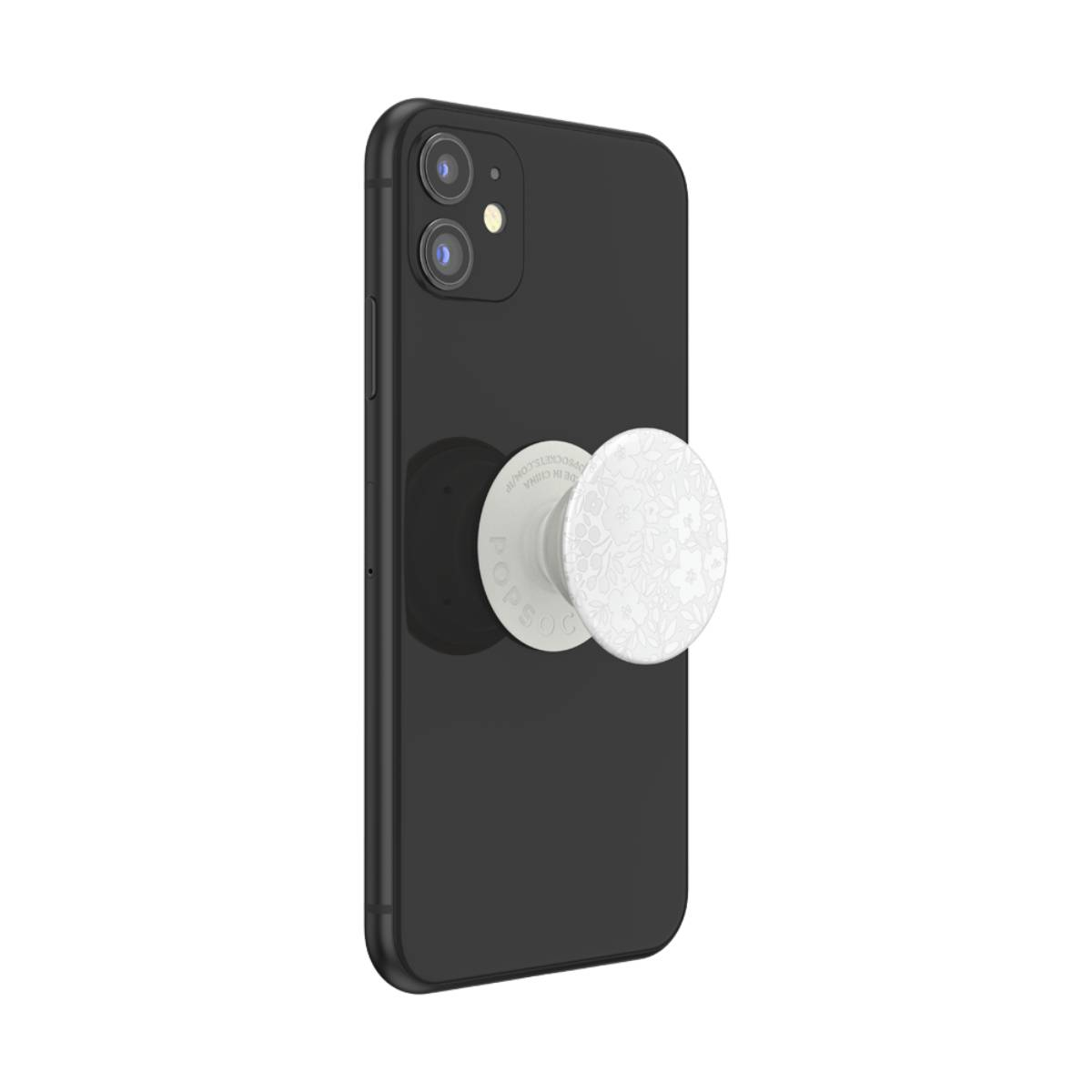 Telefono nero con PopSockets bianchi attaccati. I PopSockets hanno un design floreale bianco.