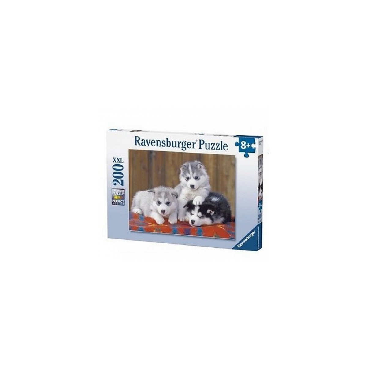 Pudełko puzzli Ravensburger z trzema szczeniakami husky.