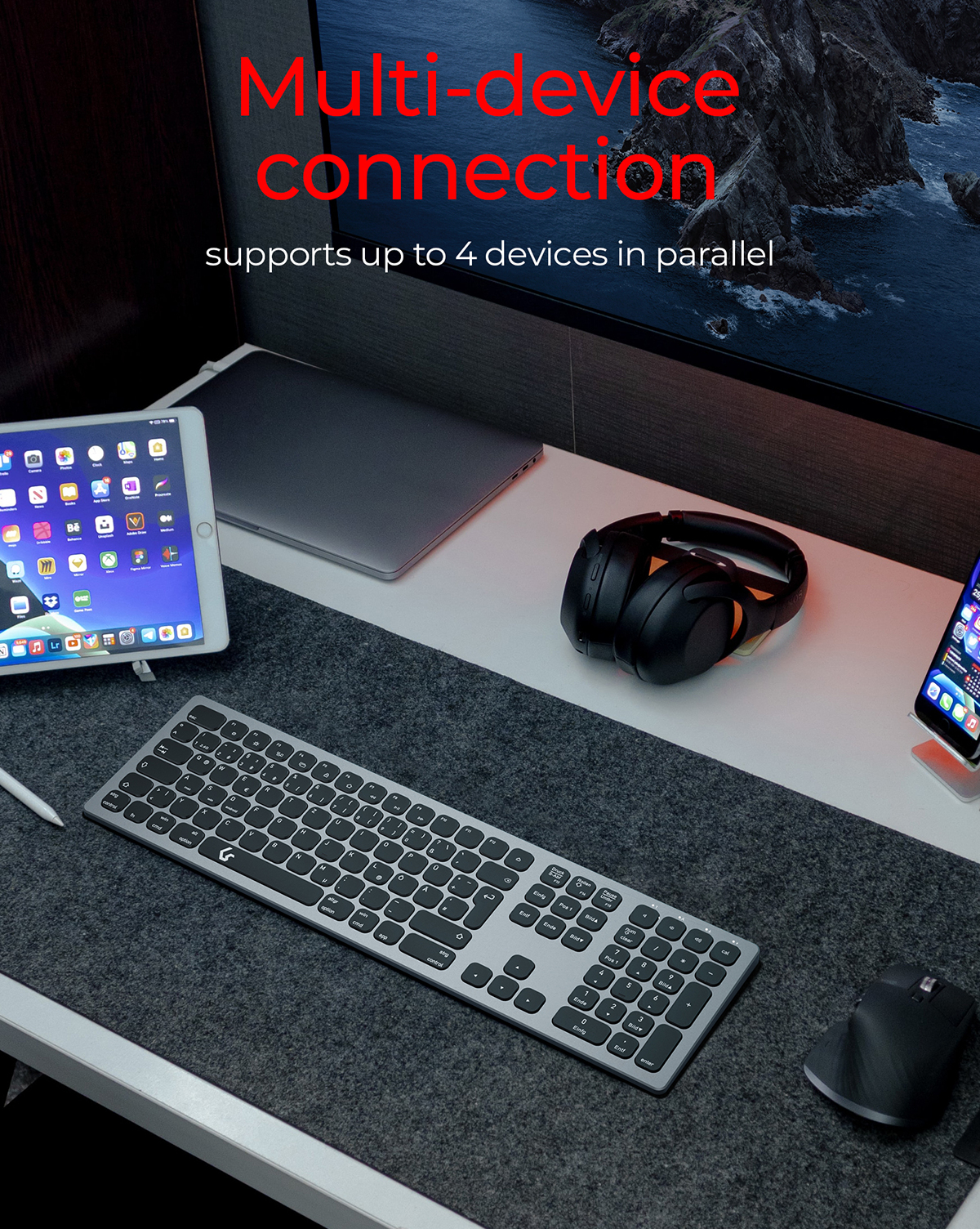 Konfiguracja biurka z klawiaturą, myszą, tabletem, słuchawkami i telefonem. Kolory biały i szary.