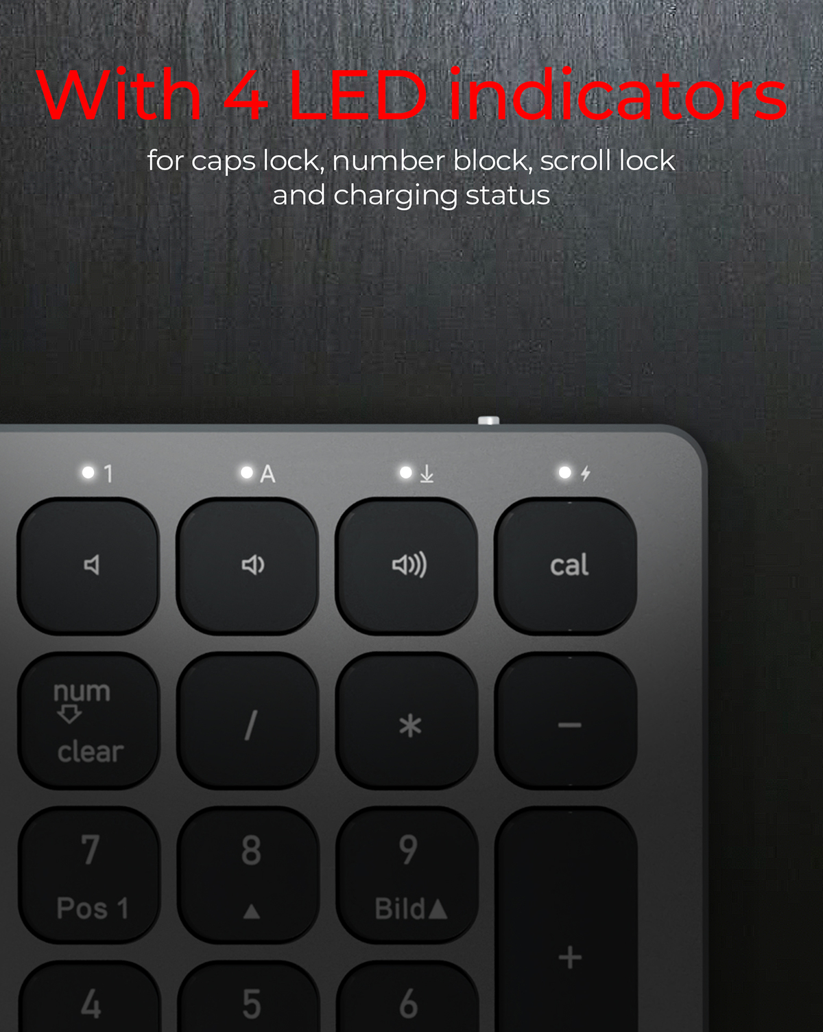 Zbliżenie klawiatury. Ma 4 wskaźniki LED. Klawisze są czarne. Tło jest ciemnoszare.