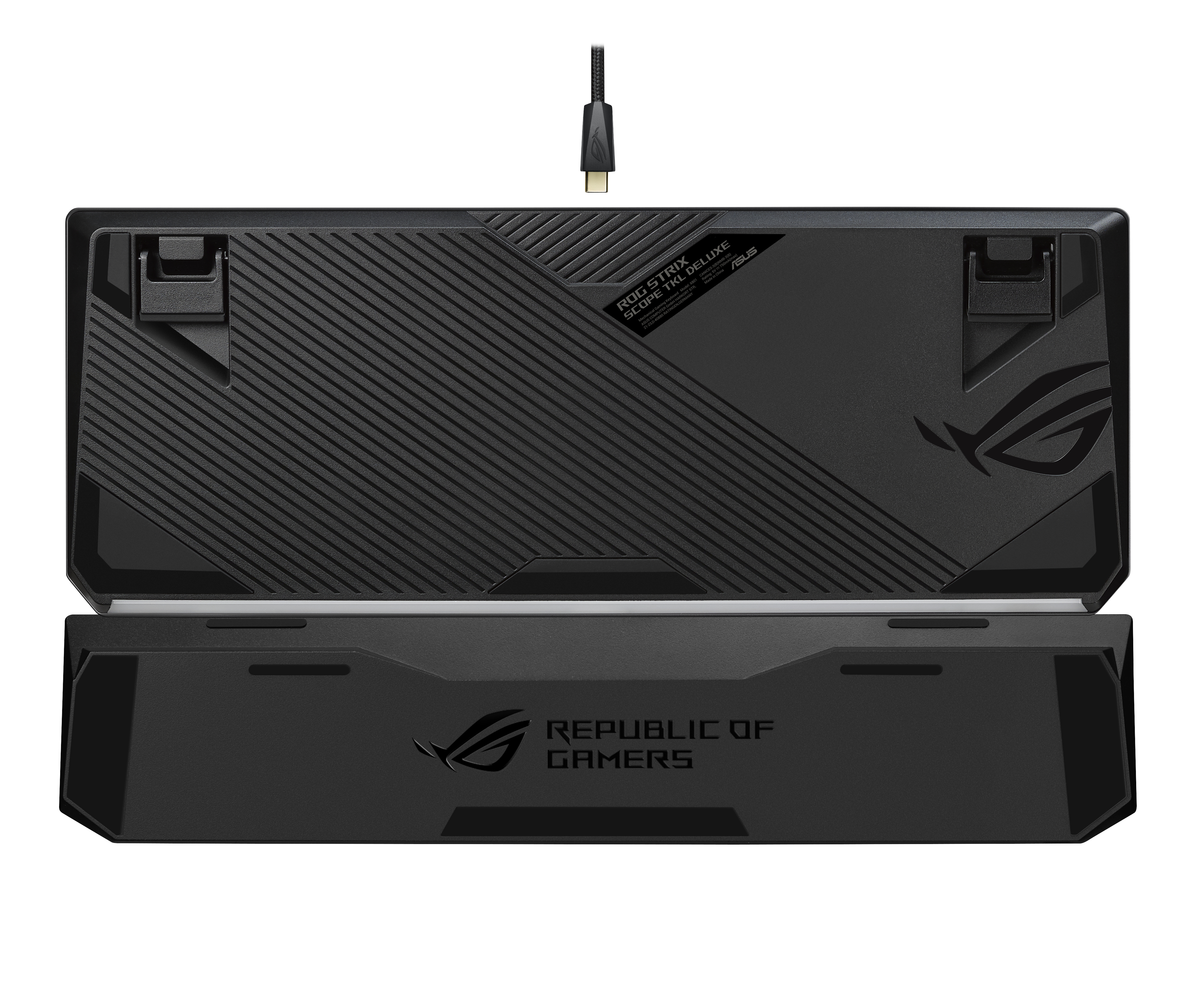 Spód czarnej klawiatury z odłączaną podpórką na nadgarstek i logo ROG oraz kablem USB.