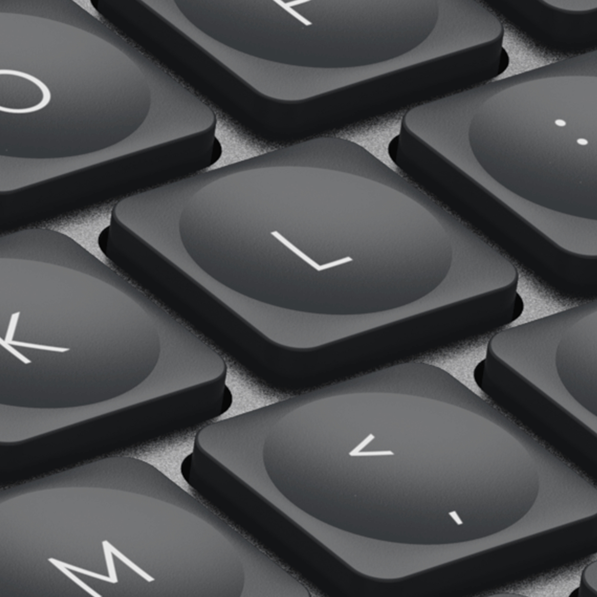 Nahaufnahme von Tastaturtasten. Die Taste 'L' ist im Fokus. Weitere Tasten sind 'K', 'M' und der Punkt.