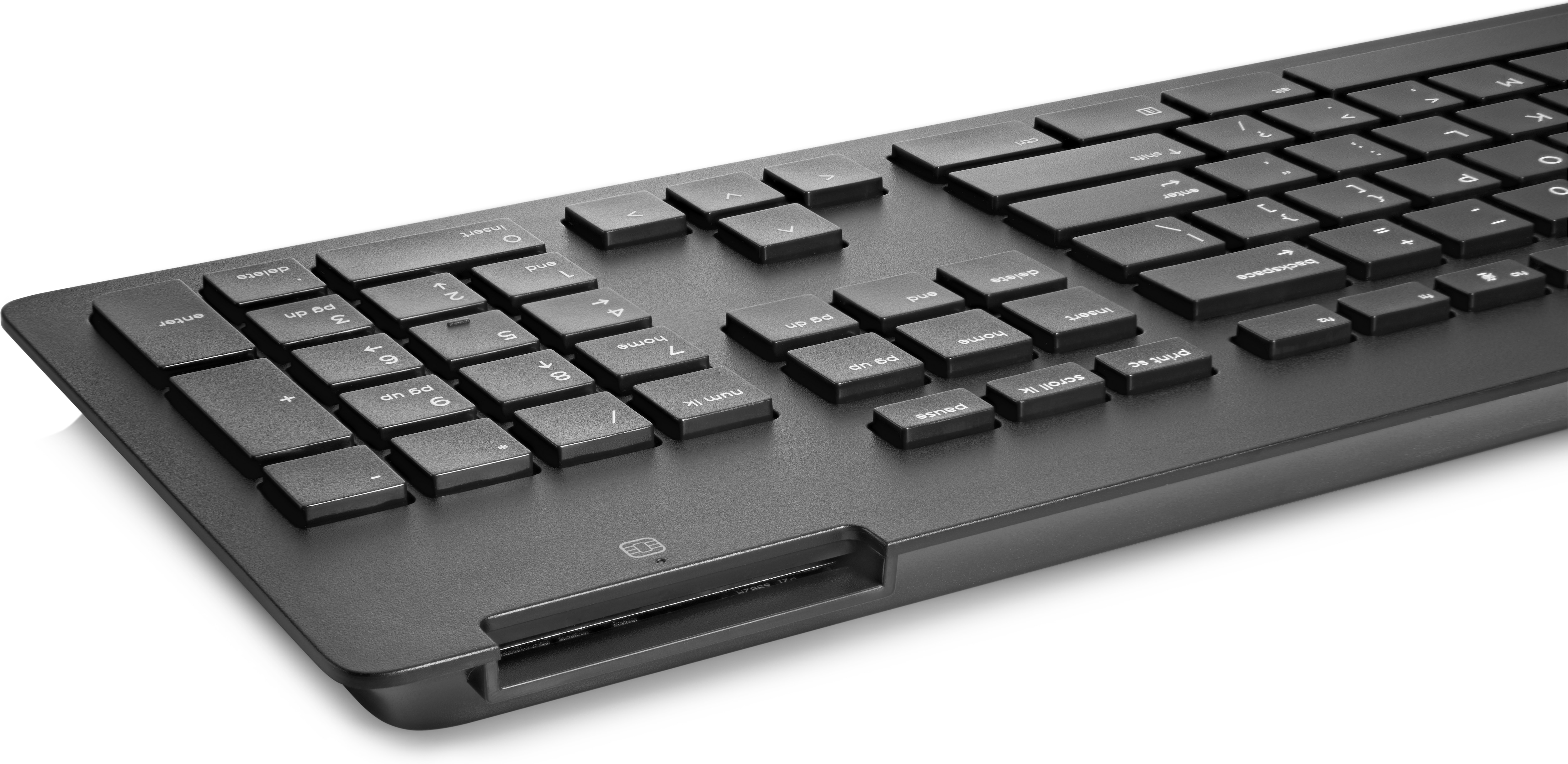 Black keyboard.  Low profile design.  Number pad.  Close-up shot.  Black keys.  White label.