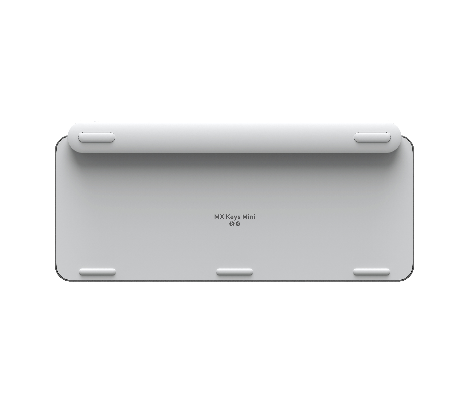 Widoczna jest spodnia strona białej klawiatury. Ma cztery gumowe nóżki i markę.