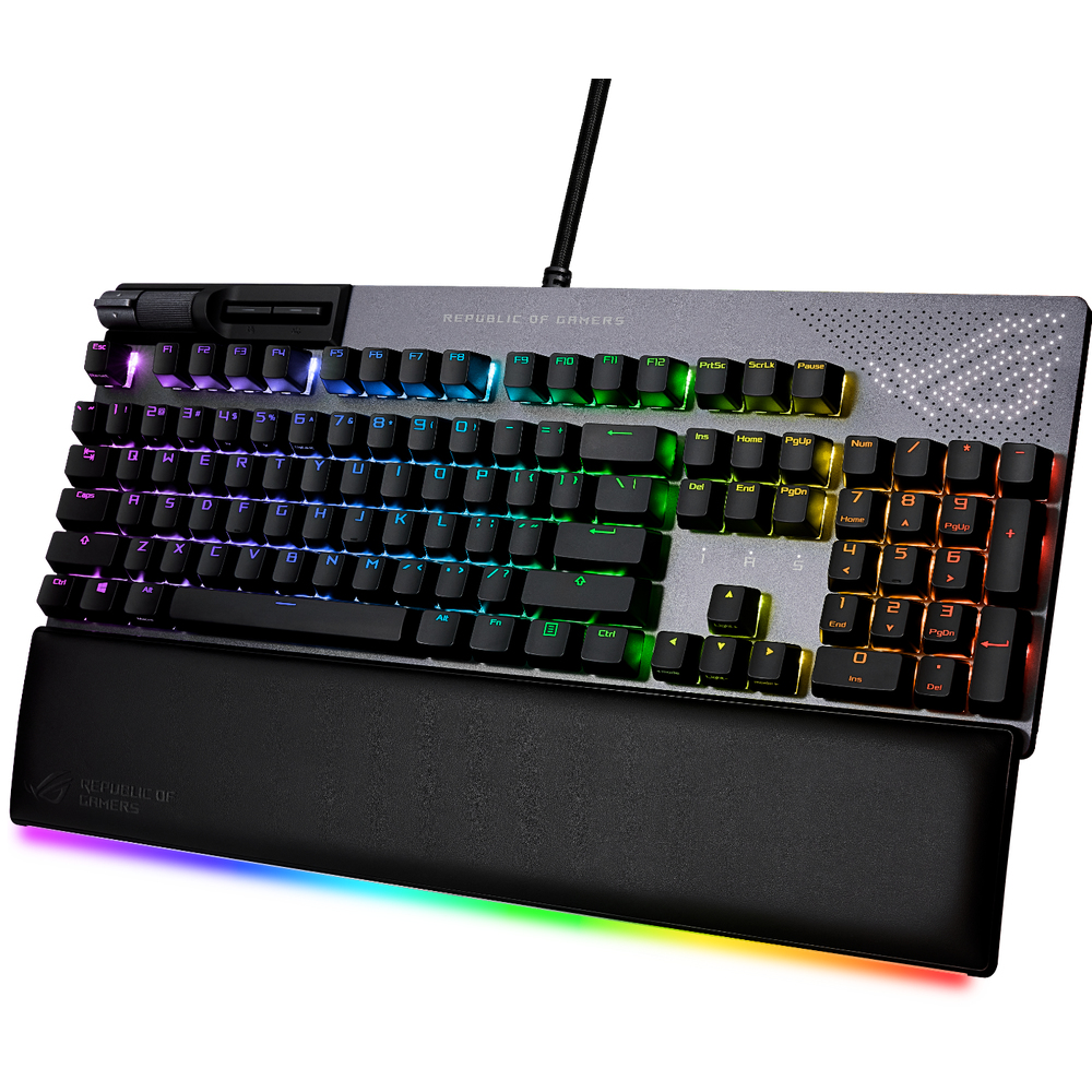 Teclado gaming con iluminación RGB y reposamuñecas. Logotipo ROG visible. Teclas retroiluminadas y coloridas.