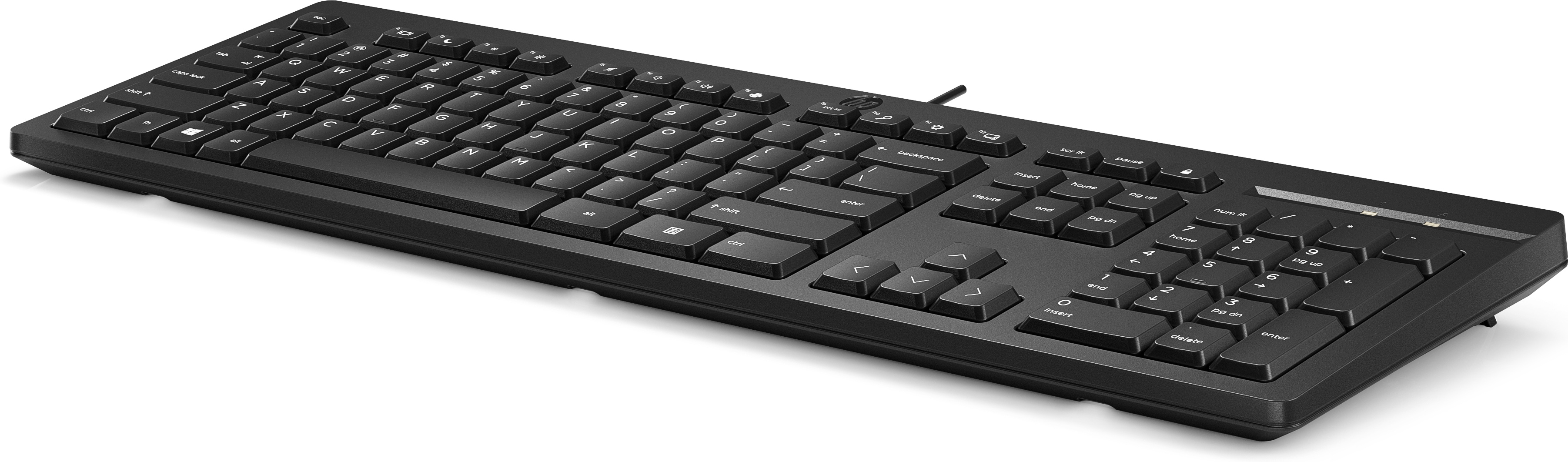 Black keyboard on a white desk next to a computer.