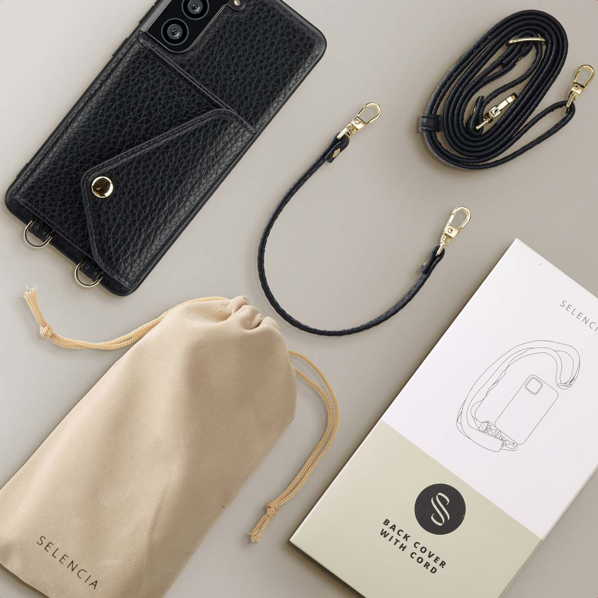 Custodia nera per telefono con portafoglio. Sono visibili anche un cinturino nero e una pochette beige.