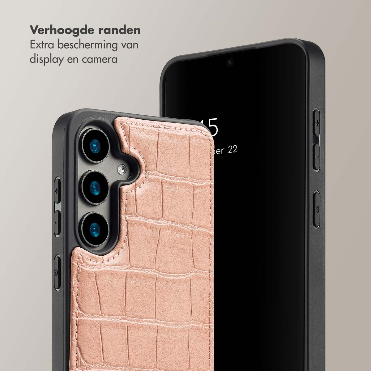 Twee telefoons, een in een roze hoesje, de andere zwart. De roze hoes heeft een textuur.