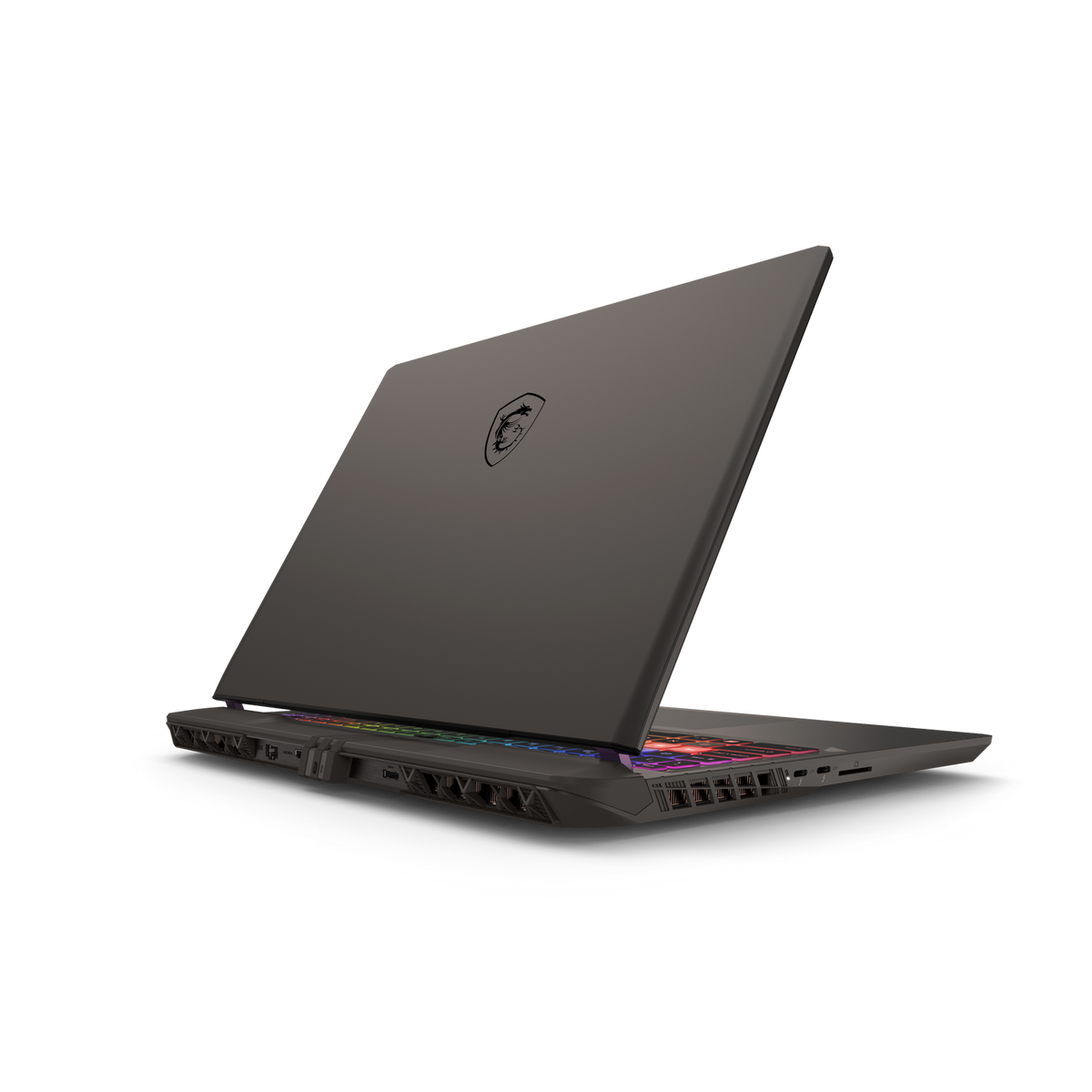 Un portátil negro, abierto, con teclado colorido sobre fondo negro.