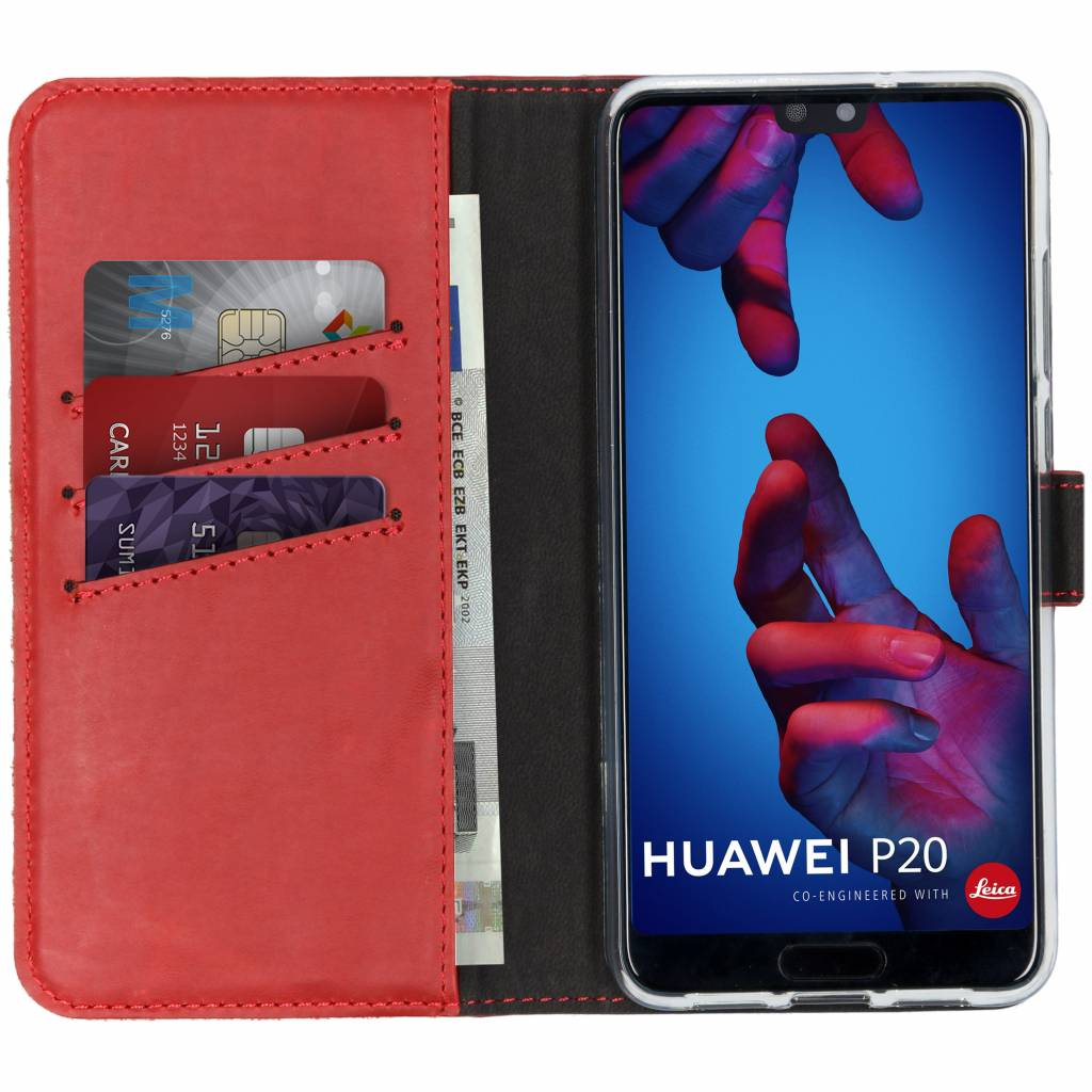 Étui de téléphone rouge avec cartes et argent. Un téléphone est visible, l'écran affiche un design coloré.