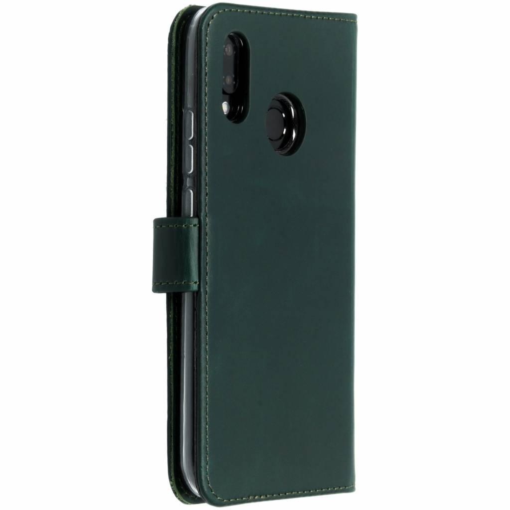 Dark green phone case, closed, showing the side profile with the button.