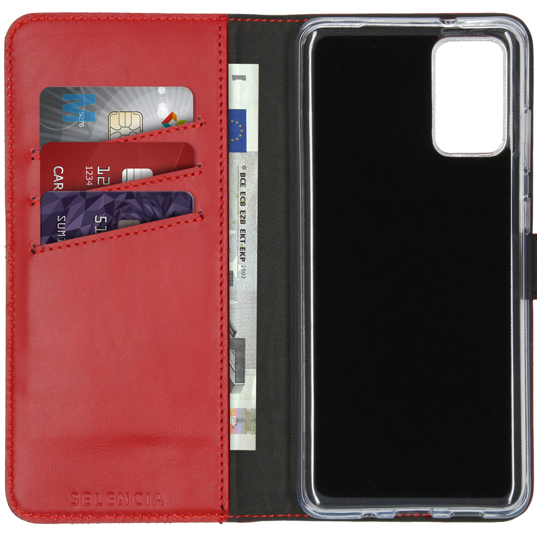 Étui de téléphone rouge ouvert pour révéler des cartes, de l'argent et un téléphone.