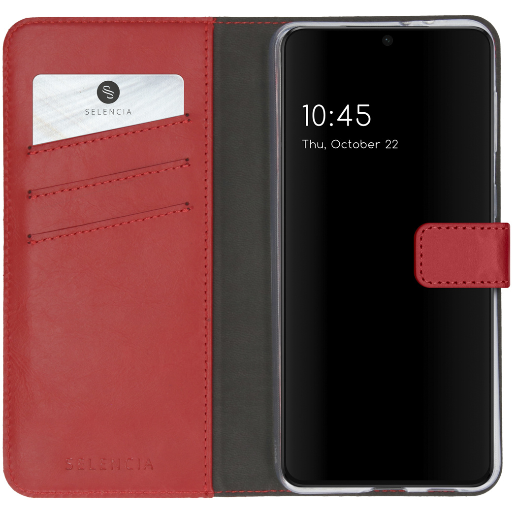 Telefono in custodia di pelle rossa. Il telefono ha uno schermo nero. Sfondo rosso e grigio.