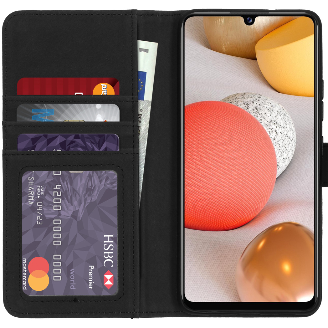 Coque de téléphone noire ouverte avec cartes et espèces, l'écran du téléphone affiche un graphique coloré.
