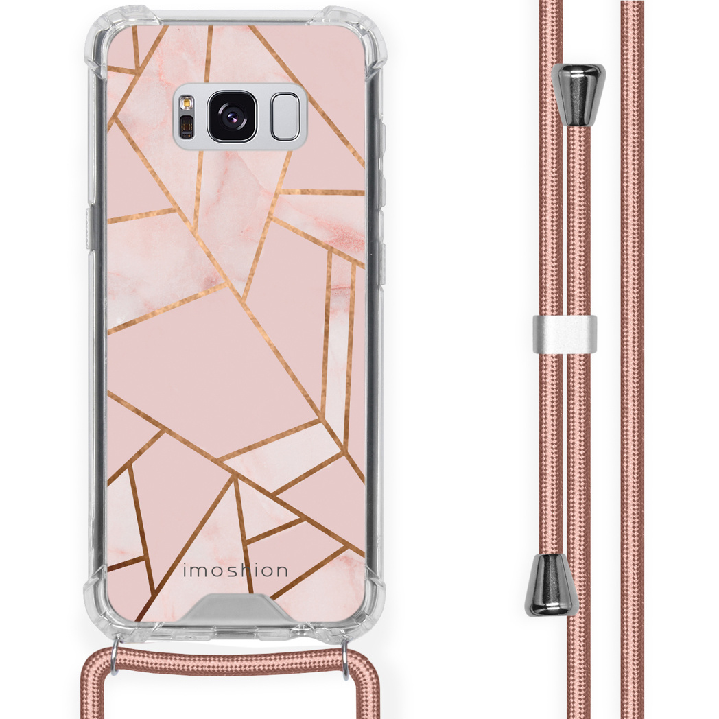 Coque de téléphone avec une sangle, design géométrique rose et doré.