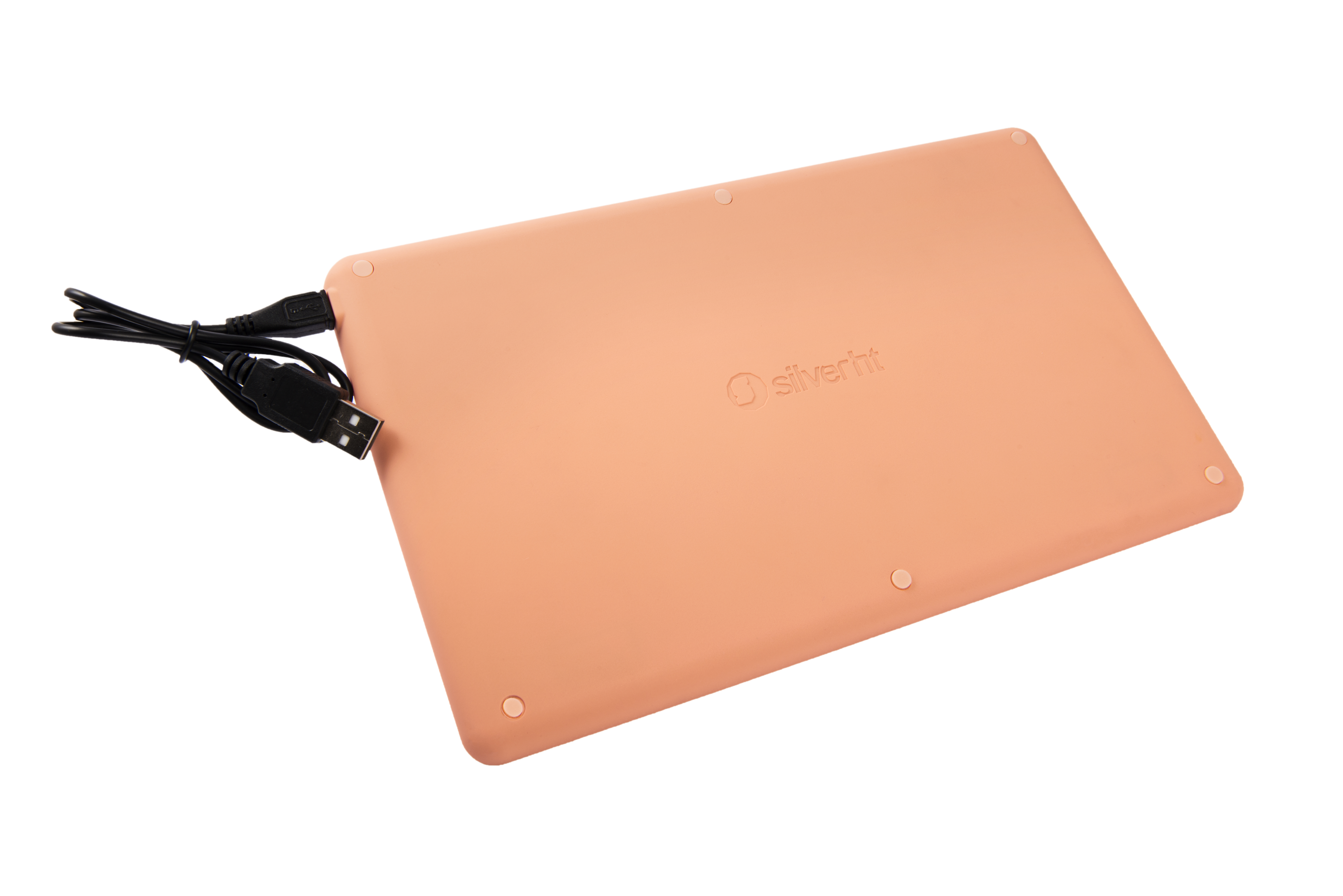 Parte trasera melocotón de un teclado inalámbrico con cable USB.