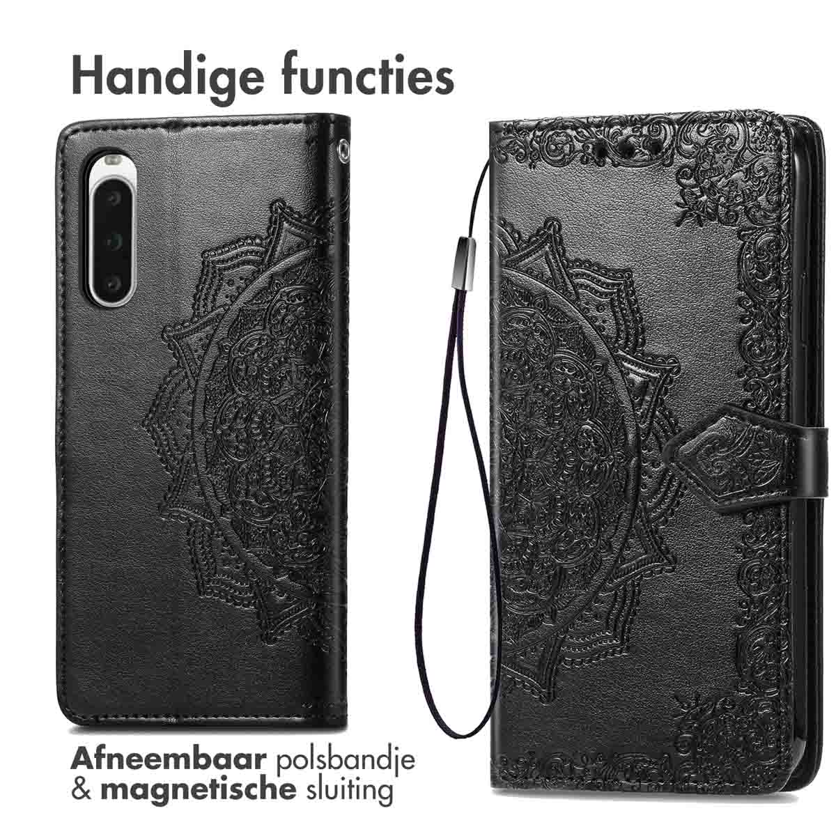 Coque de téléphone noire avec motif mandala, dragonne amovible et fermeture magnétique.