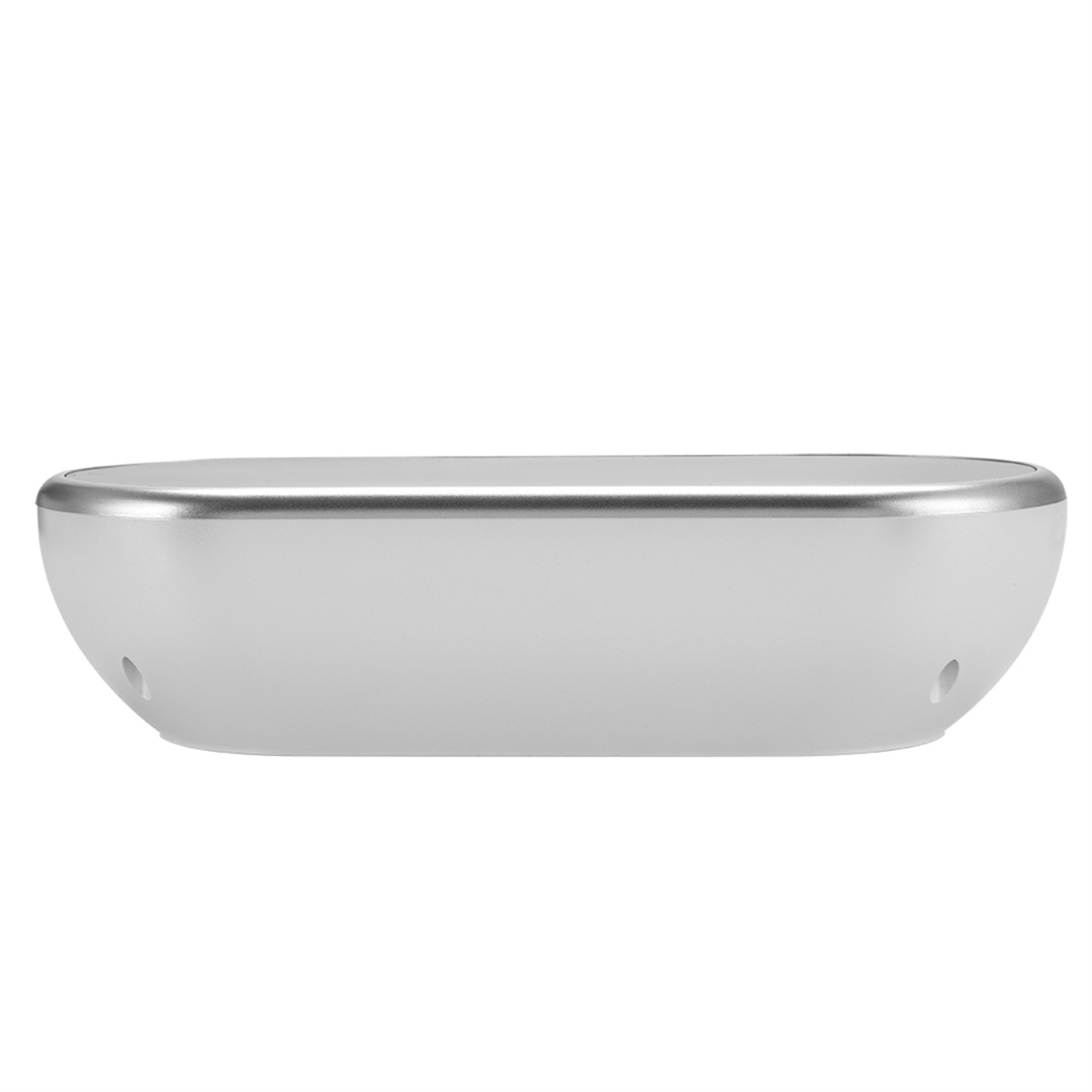 Ein weißes, oval geformtes Gerät mit silberner Umrandung, das auf einer weißen Oberfläche mit zwei Löchern liegt.