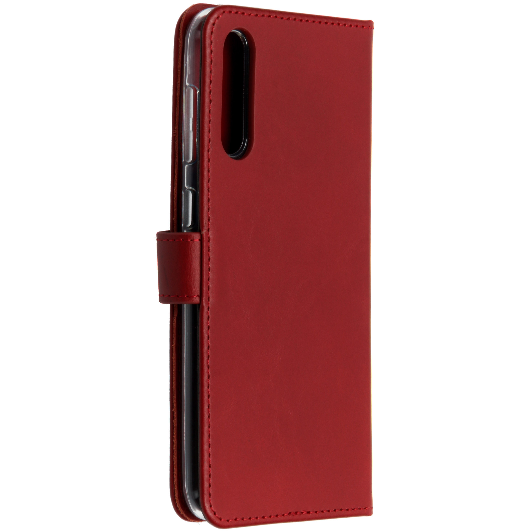 Un étui de téléphone rouge fermé avec détails de couture et fermoir magnétique, téléphone à l'intérieur.