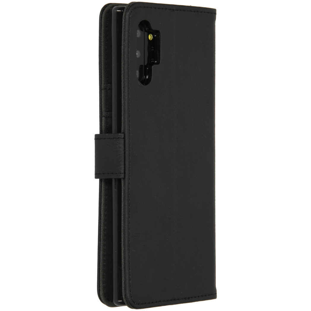 Étui portefeuille noir, ouvert. Montre un téléphone à l'intérieur.