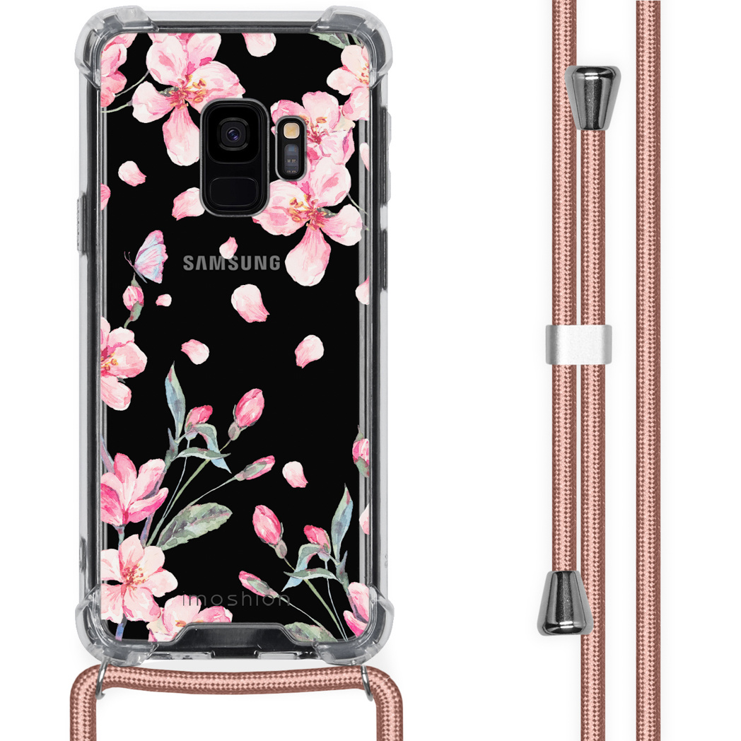 Coque de téléphone noire avec motif floral rose et corde rose. Orientation verticale.