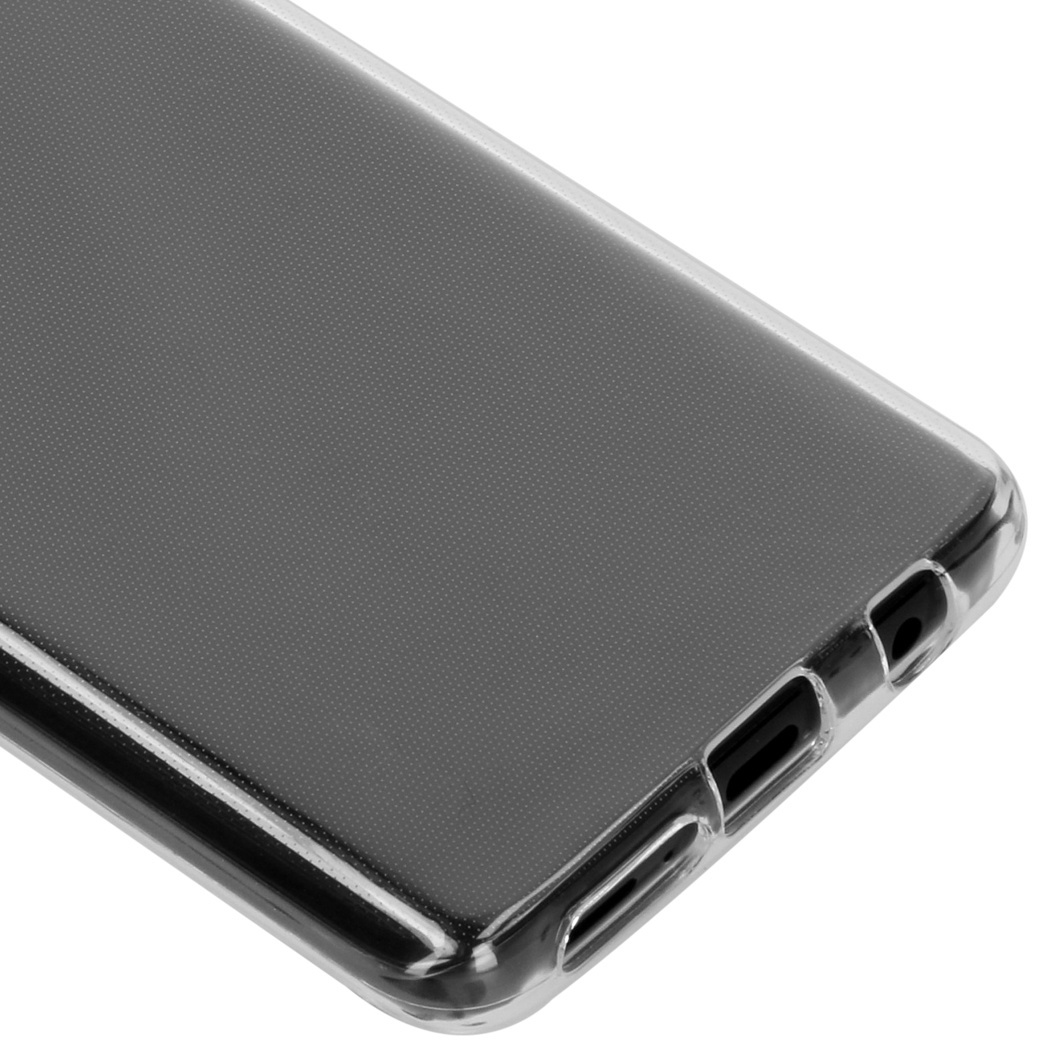 Coque de téléphone transparente, vue en angle. Montre les ports et une surface texturée.