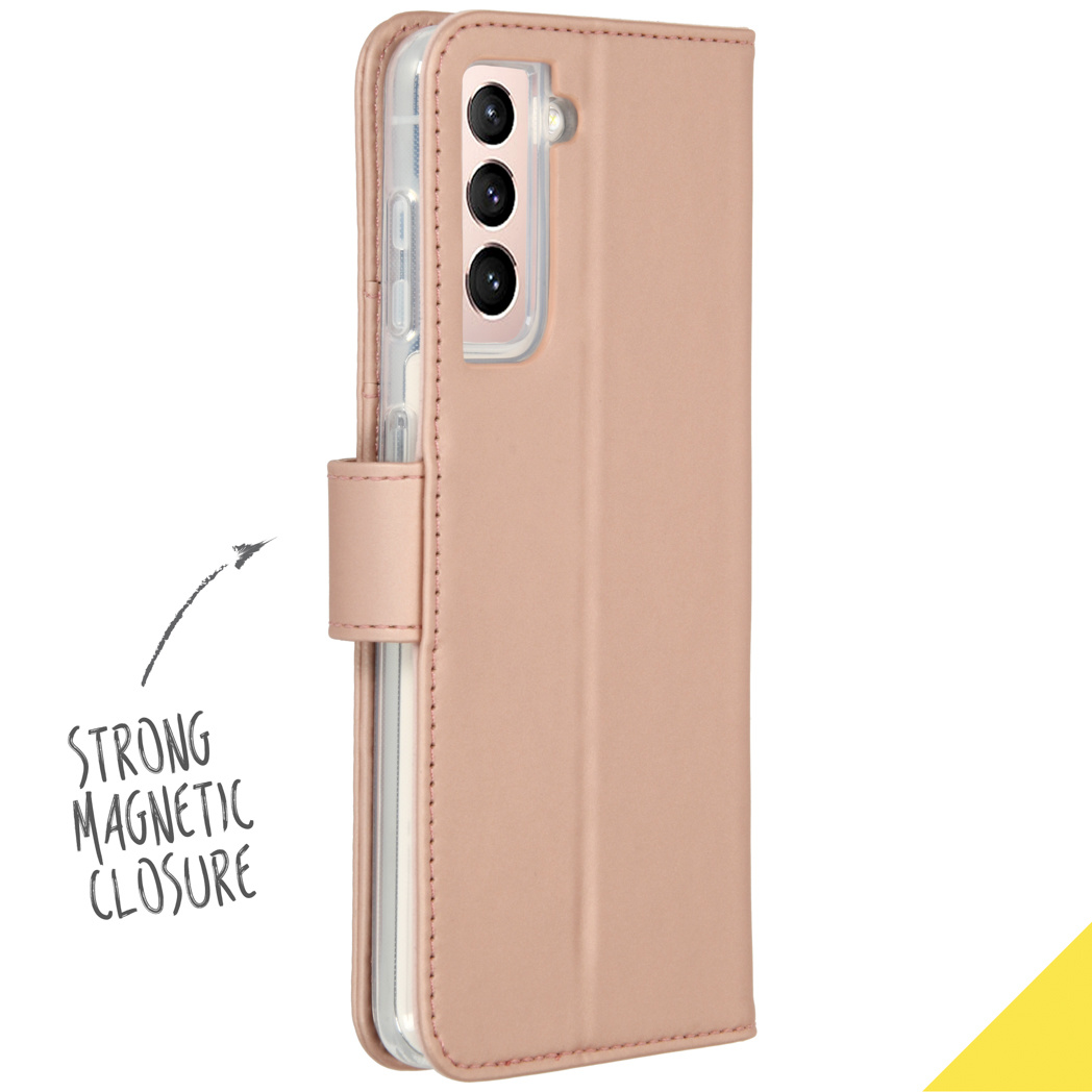 Un étui de téléphone rose avec fermeture magnétique. Le texte 'STRONG MAGNETIC CLOSURE' est visible.