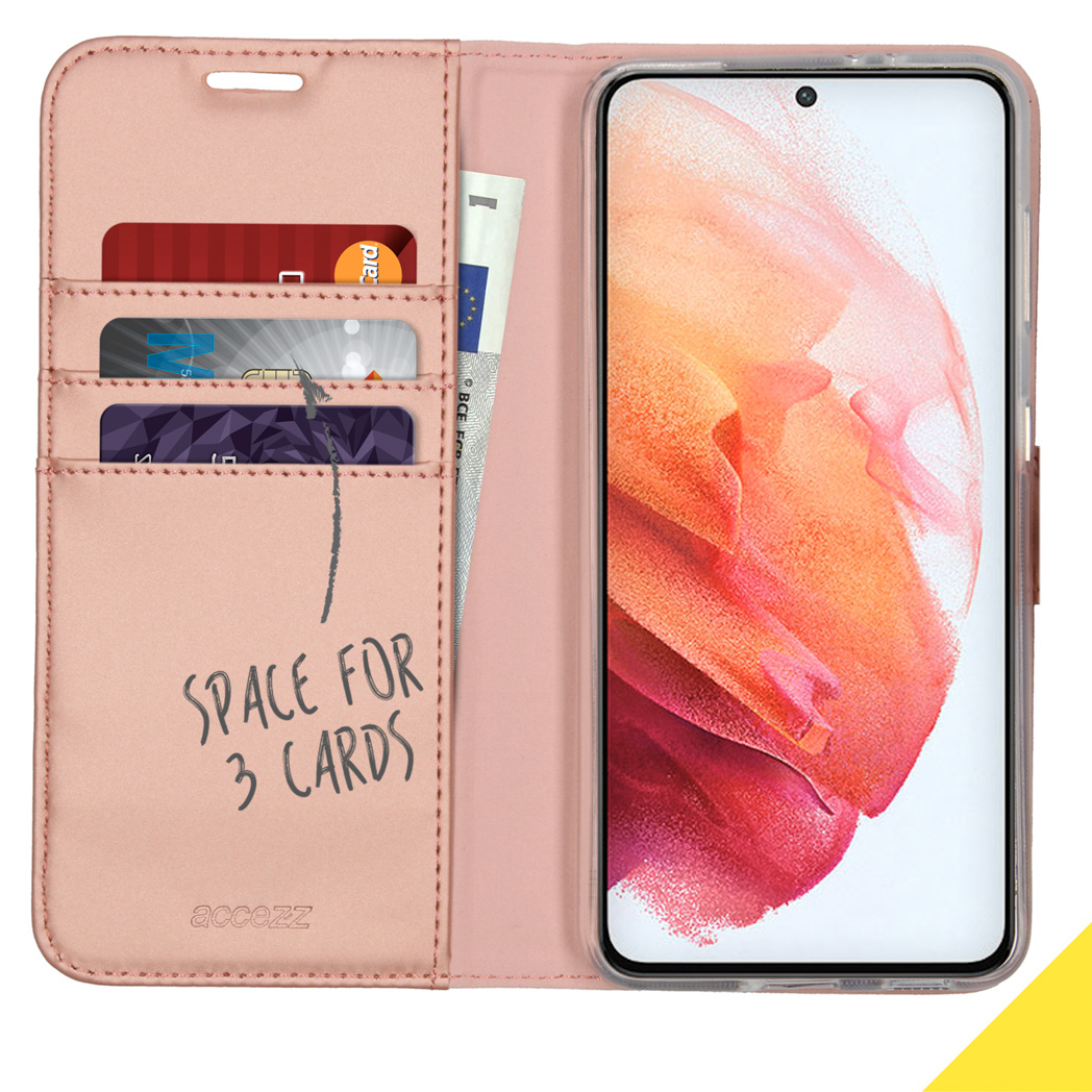 Étui de téléphone rose, ouvert, avec cartes et argent. Espace pour 3 cartes. Fond blanc.