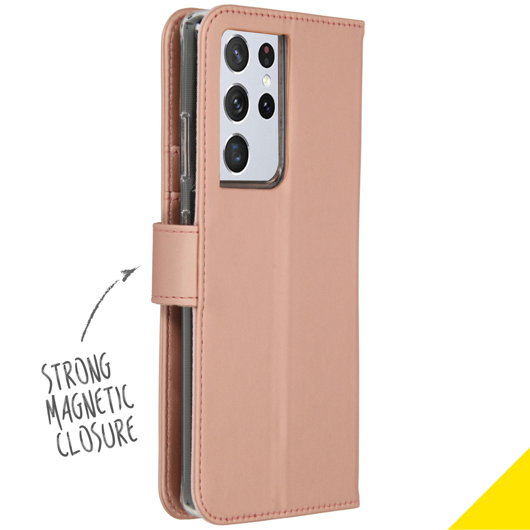 Roze telefoonhoesje met een magnetische sluiting, met een telefoon erin.