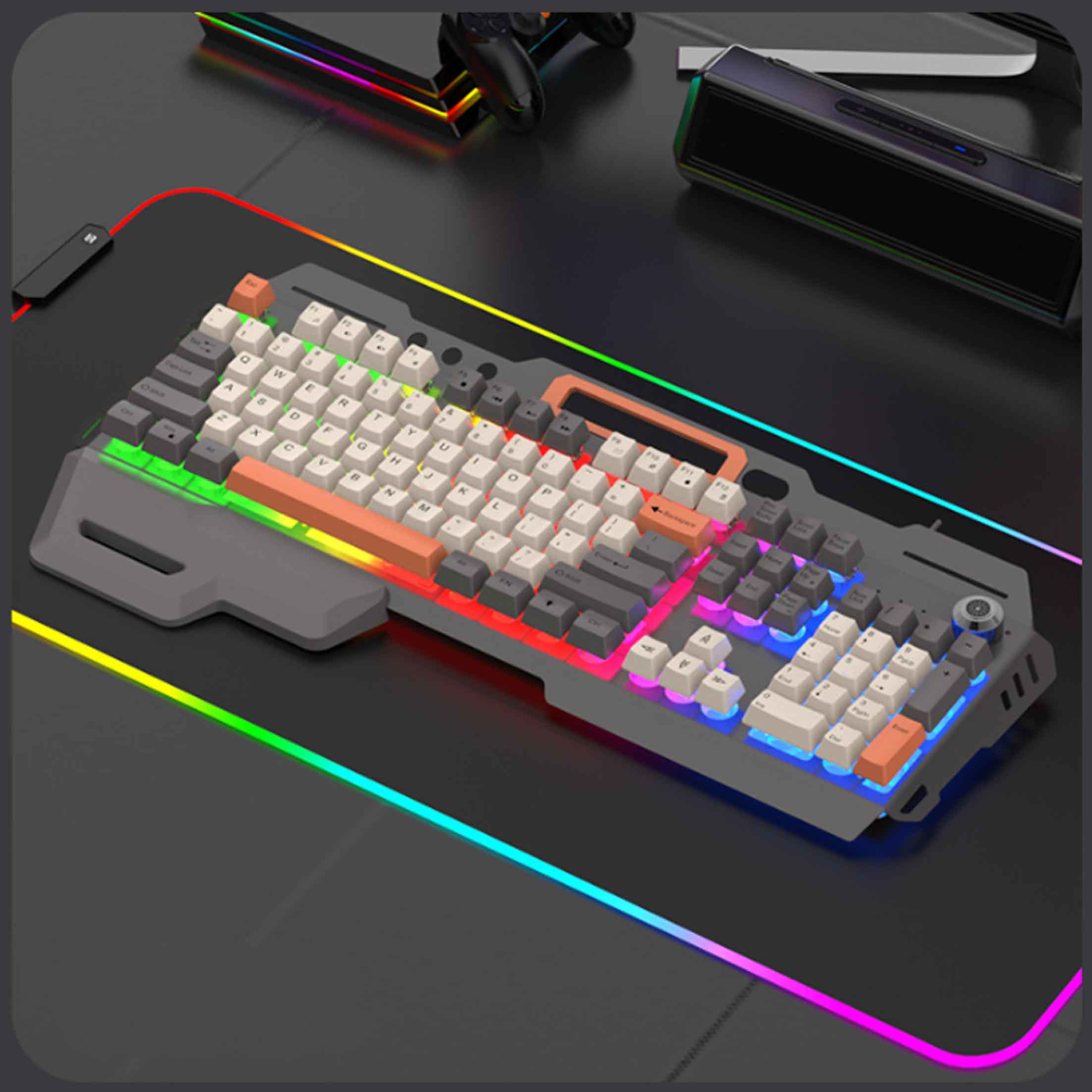 Klawiatura do gier z kolorowymi diodami LED, podkładka pod mysz i czarna powierzchnia.