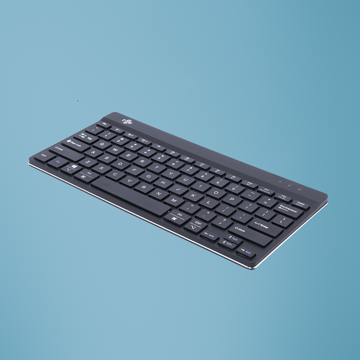 Black keyboard on a blue background. The keyboard has white keys.