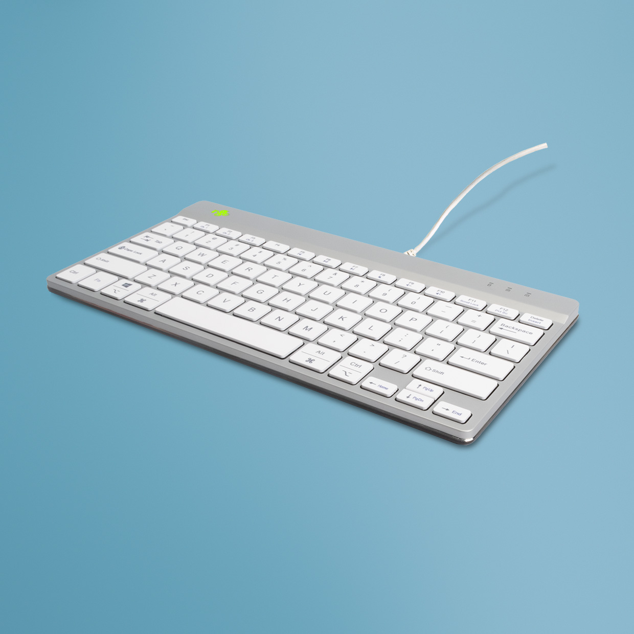 Silver keyboard on a blue background.
