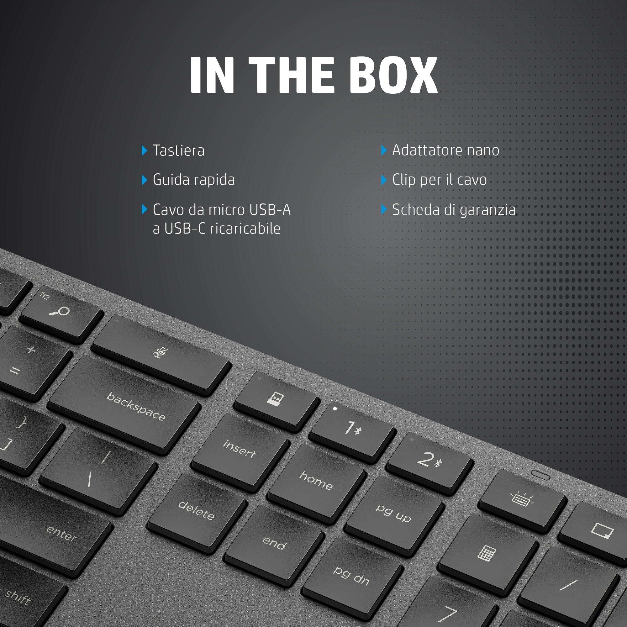 Primo piano su una tastiera e la sua scatola che mostra gli elementi inclusi come cavo USB e nano adattatore.
