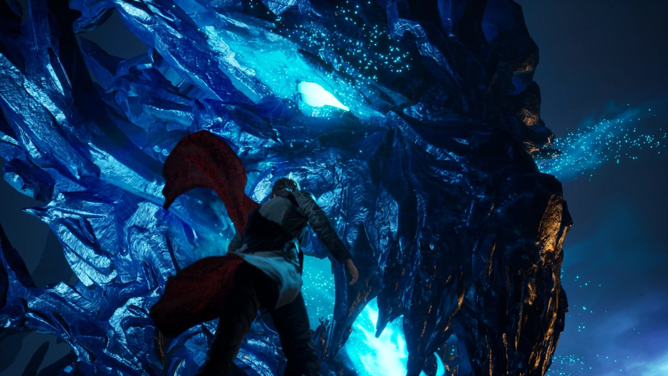 Una figura di fronte a un drago blu gigante. La scena è scura e drammatica.