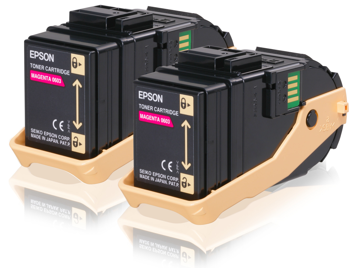 Due cartucce toner magenta Epson in un vassoio beige. Le cartucce sono nere.