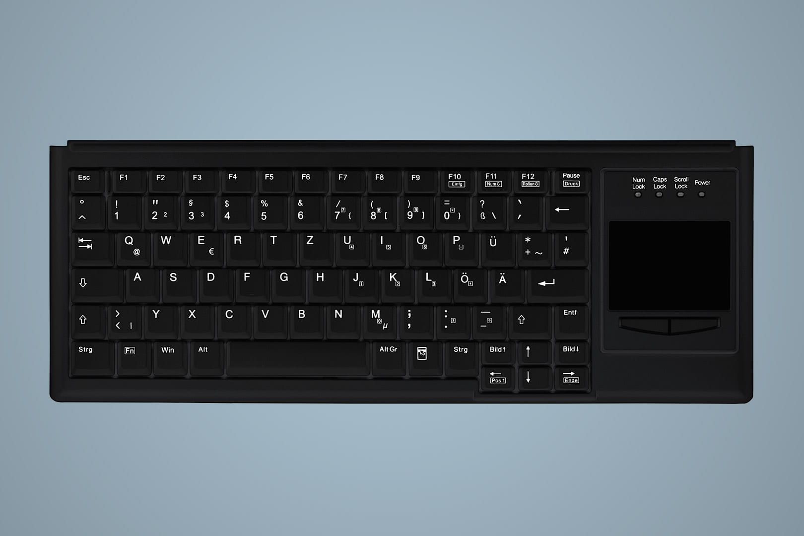 Tastiera nera con touchpad a destra. Lettere e simboli bianchi. Sfondo azzurro.