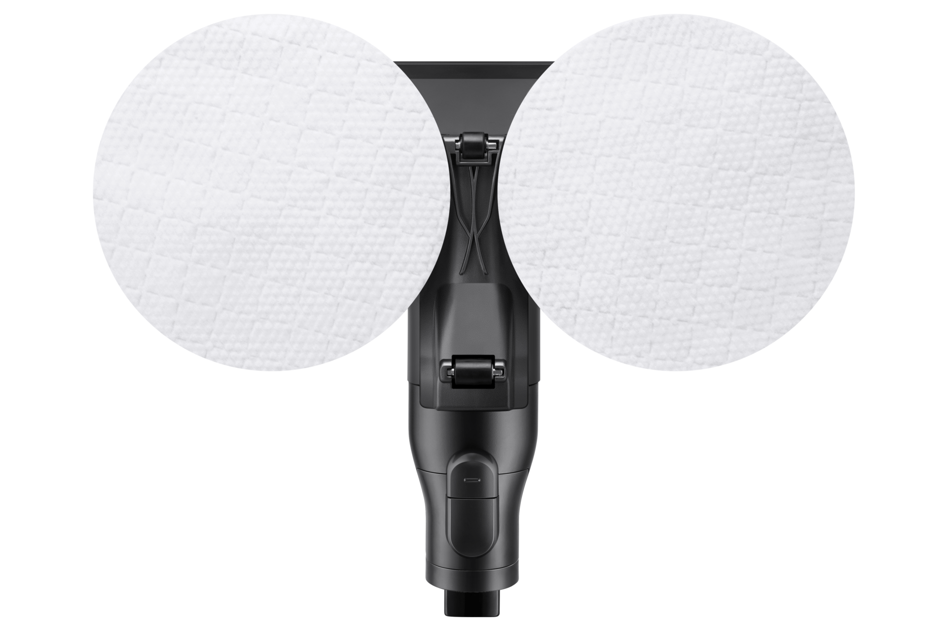 Nahaufnahme von zwei weißen Reinigungspads auf einem schwarzen Reinigungsgerät. Die Pads sind strukturiert.