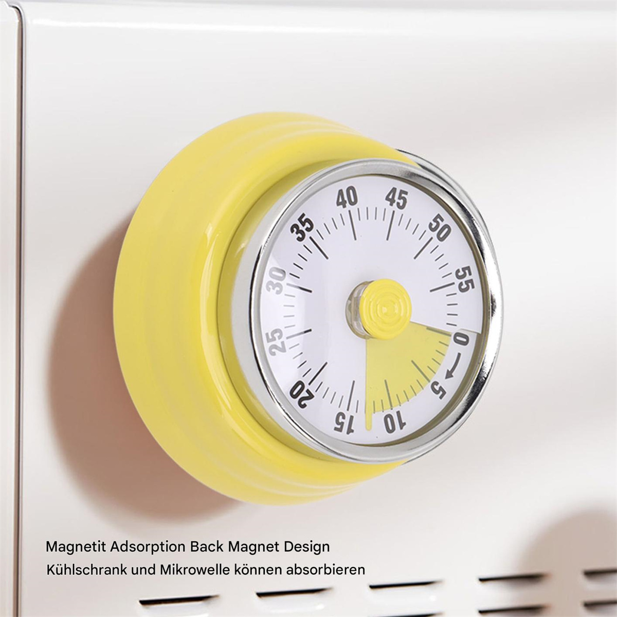 Ein gelber magnetischer Küchentimer. Er ist auf einer weißen Oberfläche montiert. Der Timer zeigt 0 Minuten.