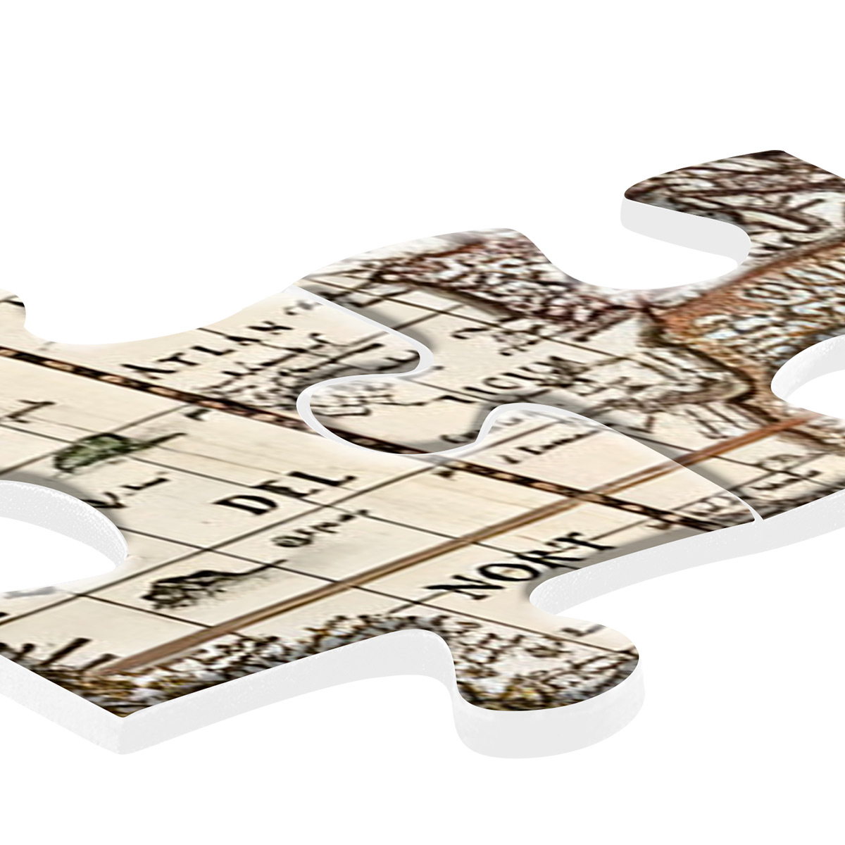 Element układanki z fragmentem mapy. To zbliżenie elementu układanki z nadrukowaną mapą.