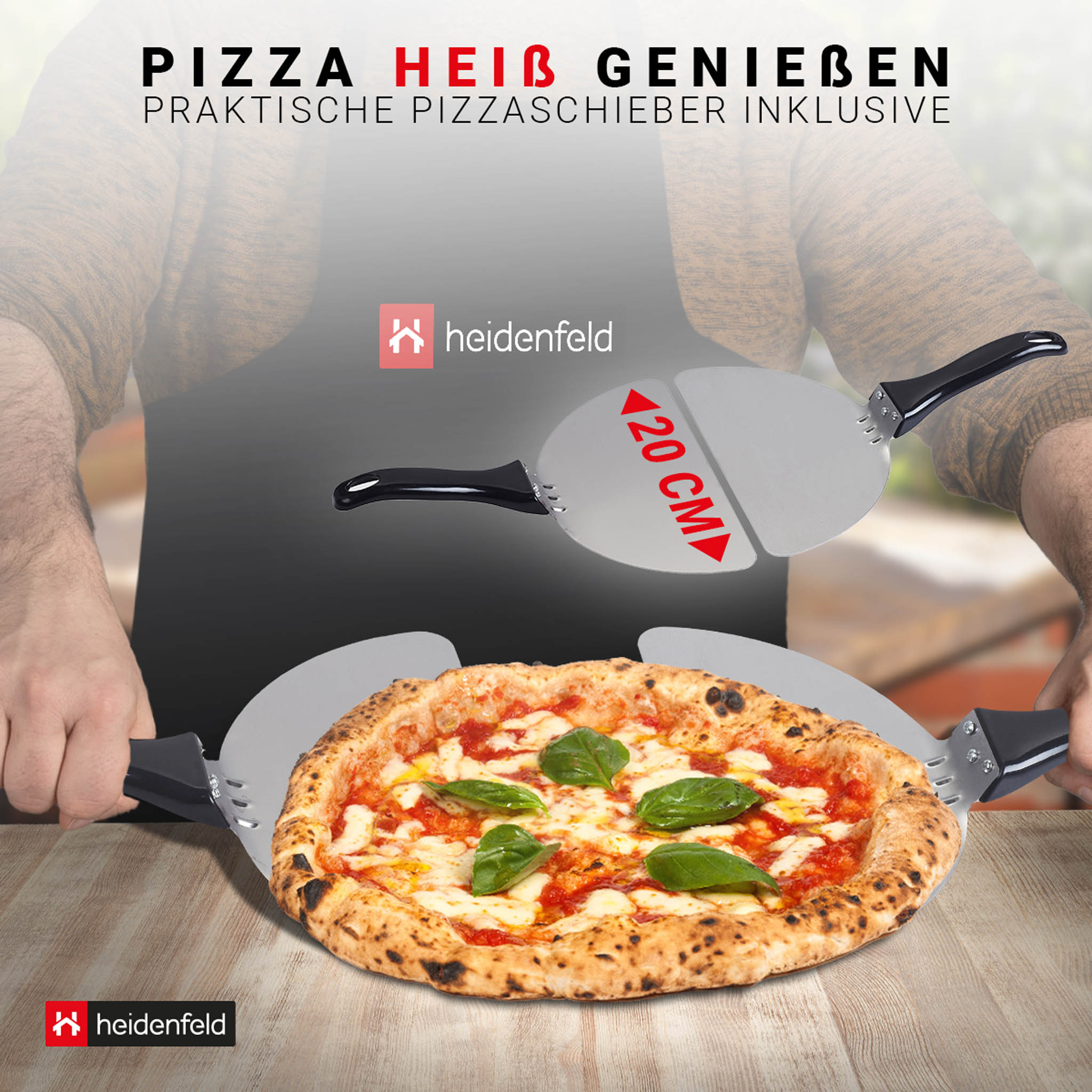 Eine Pizza mit Basilikum auf einem Holztisch. Zwei Pizzaschieber daneben.