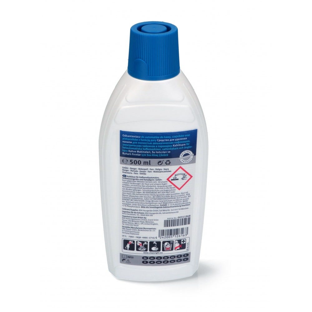Weiße Flasche mit blauem Deckel, mit Text in mehreren Sprachen. Die Flasche hat ein schwarzes Etikett.