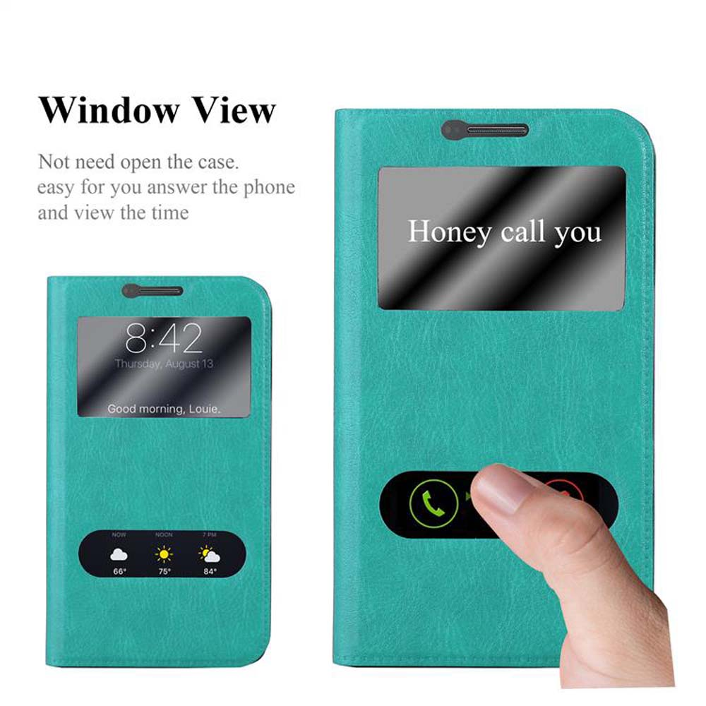 Una funda de teléfono color turquesa con ventana para ver la hora y un botón de llamada.