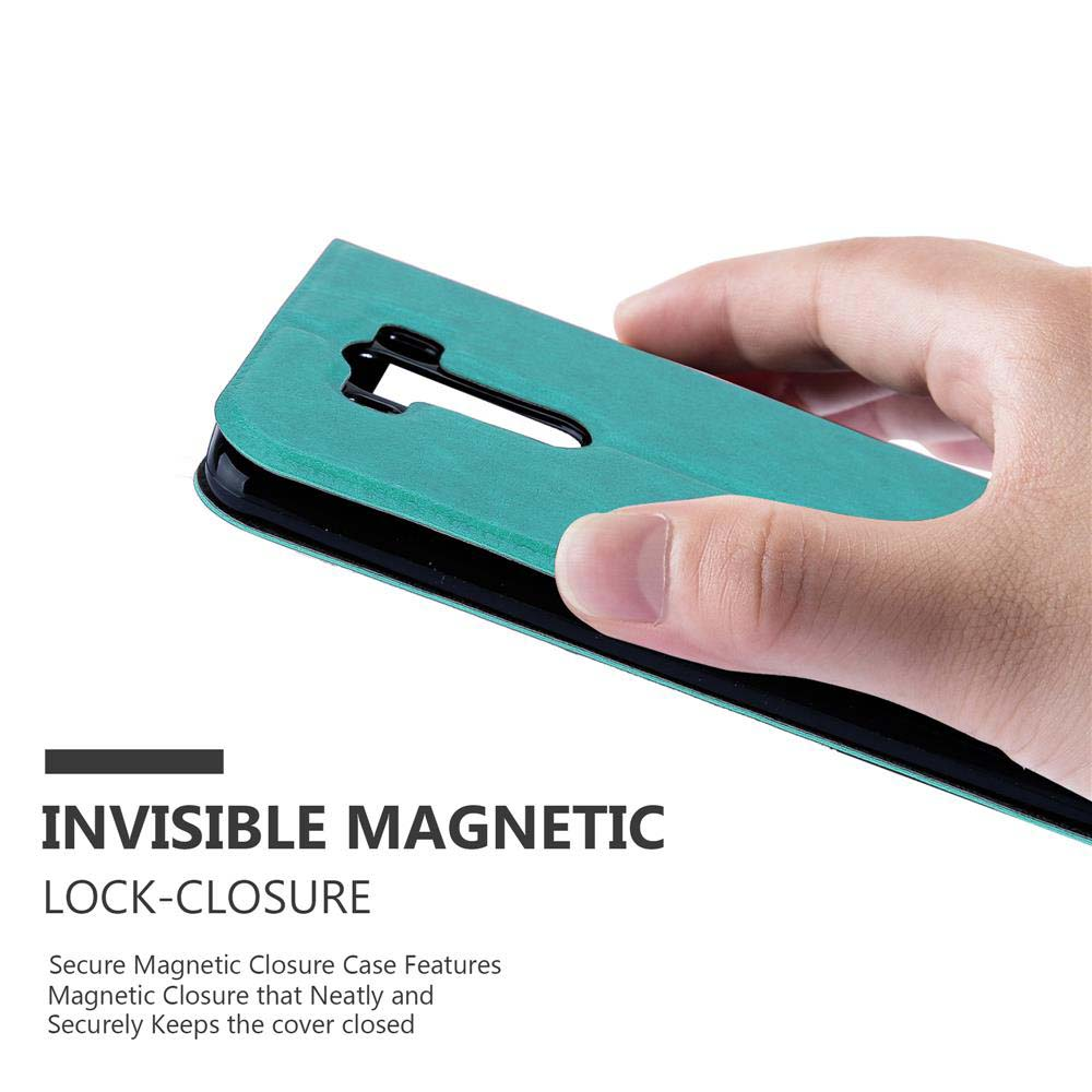 Una mano sostiene una funda de teléfono verde azulado con el texto 'INVISIBLE MAGNETIC LOCK-CLOSURE'.